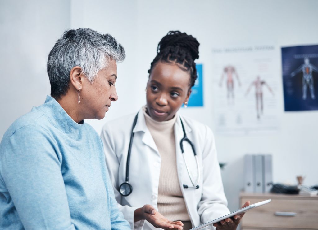 Médica com paciente